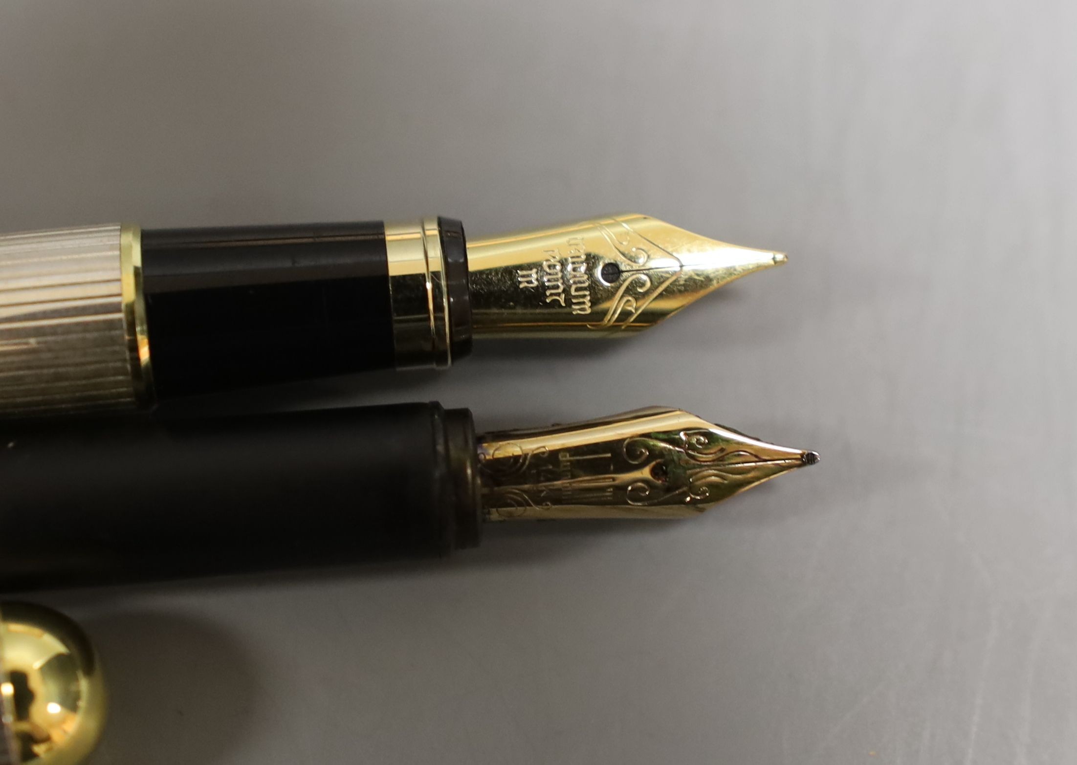 A boxed Dunhill fountain pen together with another fountain pen